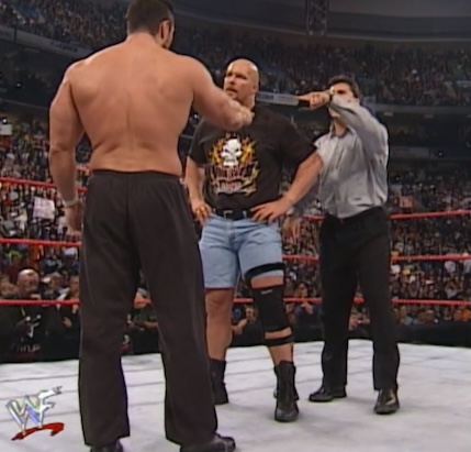 Shane McMahon and Steve Blackman surround Steve Austin at Unforgiven 2000