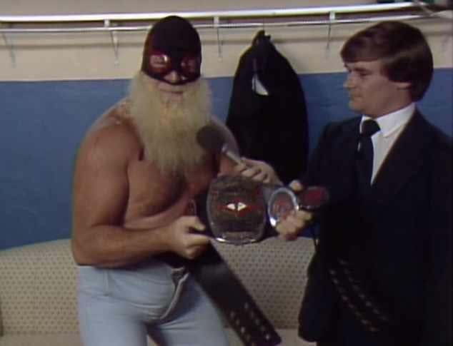 Charlie Brown from Outta town (Jimmy Valiant) talks to Tony Schiavone at Starrcade 83