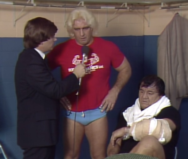 Ric Flair and Angelo Mosca talk to Tony Schiavone at Starrcade 1983