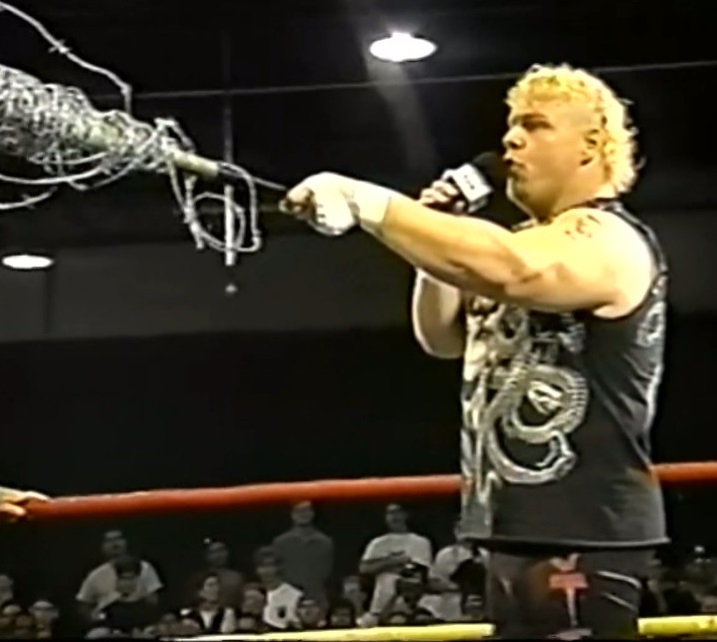 Axl Rotten wields a barbed wire baseball bat