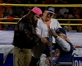 Smoky Mountain Wrestling - Ron Wright presents his famous chain to Dirty White Boy