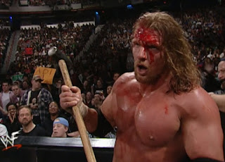 WWE / WWF No Way Out 2001 -  A Bloody Triple H prepares to drill Steve Austin with Sledgehammer