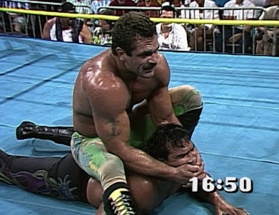 Rick Rude puts a camel clutch on Ricky Steamboat at Beach Blast 92