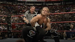 Shawn Michaels puts Bret Hart in a sharpshooter at WWF Survivor Series 1997