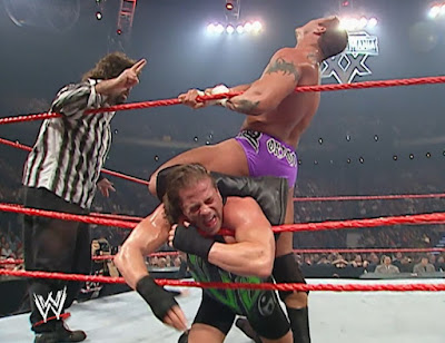 WWE Armageddon 2002 - Randy Orton puts a hurting on RVD while being admonished by referee Mick Foley