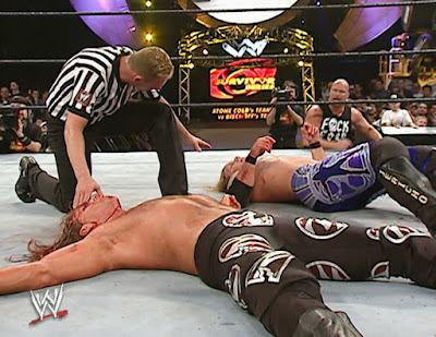 WWE Survivor Series 2003 - Austin watches as Shawn Michaels and Chris Jericho are out for the count