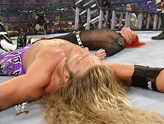 Edge and Jeff Hardy lay prone on the mat at TLC 2 - Wrestlemania 17