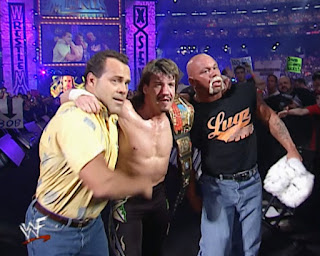 Dean Malenko and Perry Saturn help Eddie Guerrero with his European title