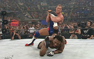 Kurt Angle puts the ankle lock on Booker T at WWF Invasion 2001