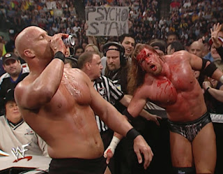 WWE / WWF Survivor Series 2000 - Steve Austin has a beer break before battering a bloody HHH