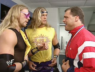 WWE / WWF Survivor Series 2000 - Kurt Angle confers with Edge & Christian backstage