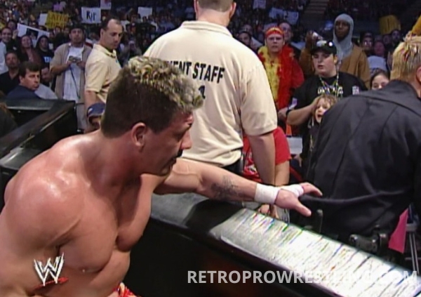 Eddie Guerrero pickpockets a cop at WWE No Mercy '04