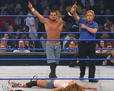 WWE No Way Out 2004 - Jamie Noble stands triumphant over Nidia WWE No Way Out 2004 - Jamie Noble stands triumphant over Nidia